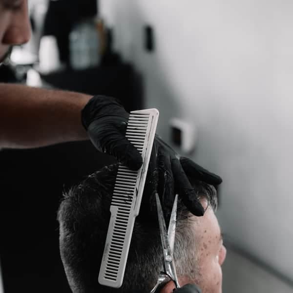 A scissor-over-comb cut on a textured top
